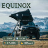 La tienda de techo Equinox frente a una montaña
