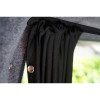 Close-up of the high-density fabric and pre-installed eyelets of the curtain