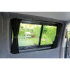 Interior of a converted Citroën Jumpy van with window blackout curtain