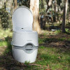 Porta Potti 565E portable toilet in a forest